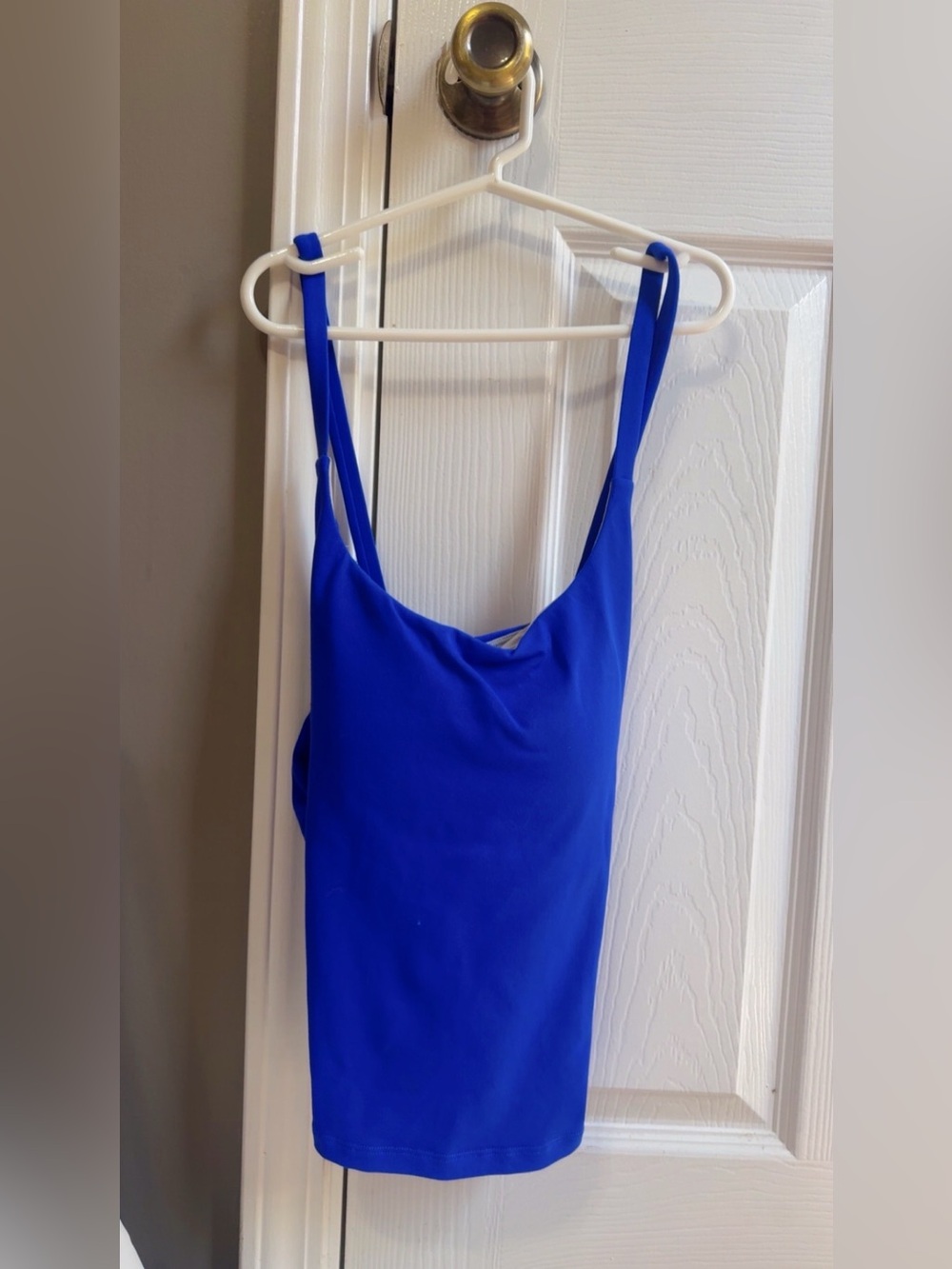 blue halara tank top, with built in padding but is removable, size medium.
